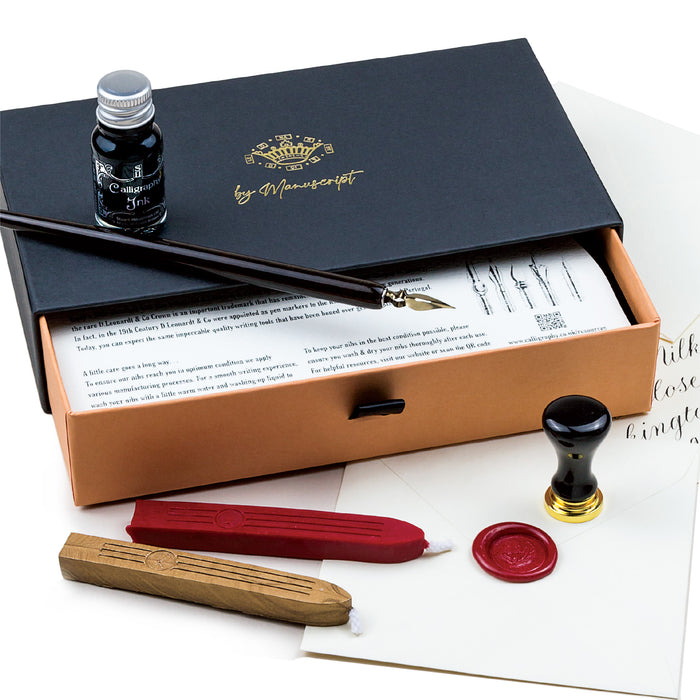 Calligraphy set with ink bottle, pen, and wax seals in a Manuscript box.