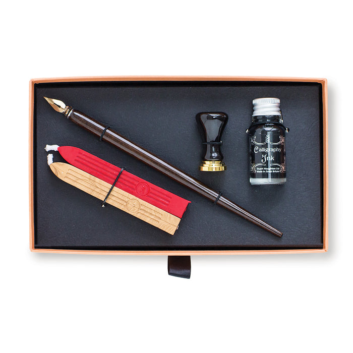 Calligraphy set with ink bottle, pen, and wax seals in a Manuscript box.