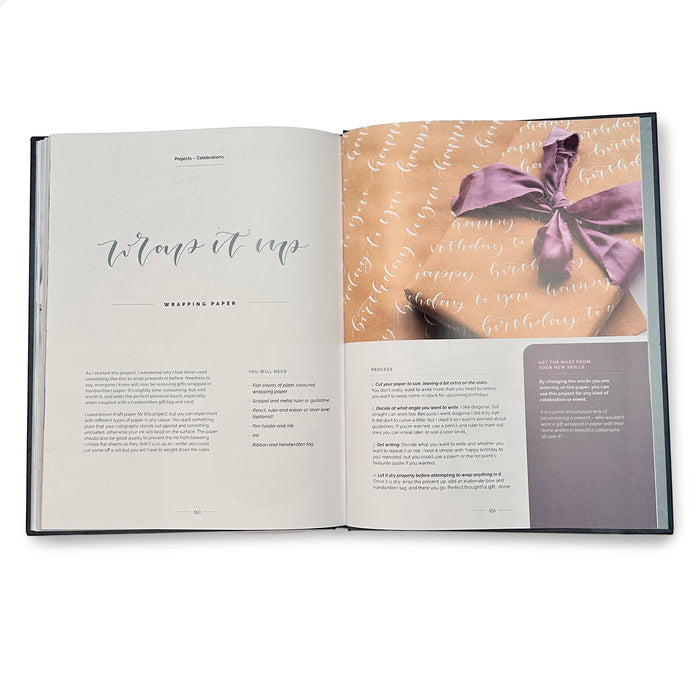 Modern Calligraphy and Hand Lettering  book with a page featuring a purple bow on hand written wrapping paper