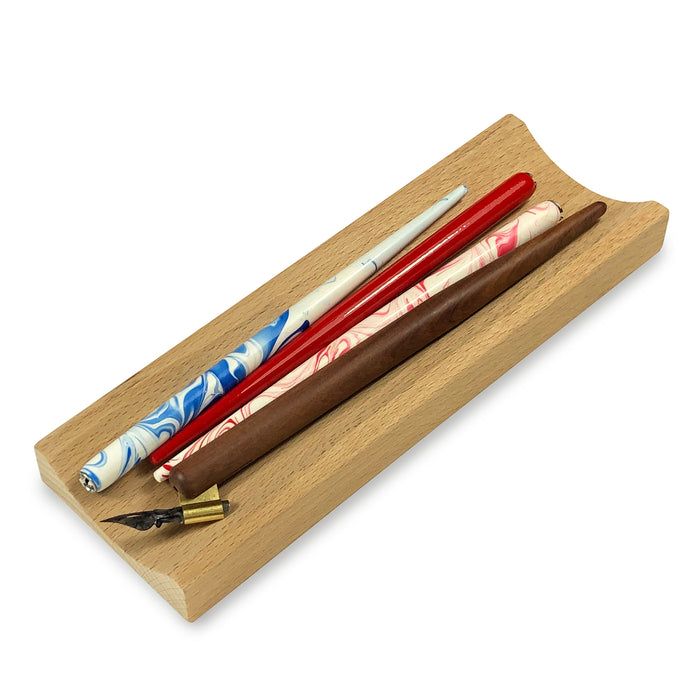 Wooden Pen Tray Filled With Calligraphy Pen Holders and Dip Pen